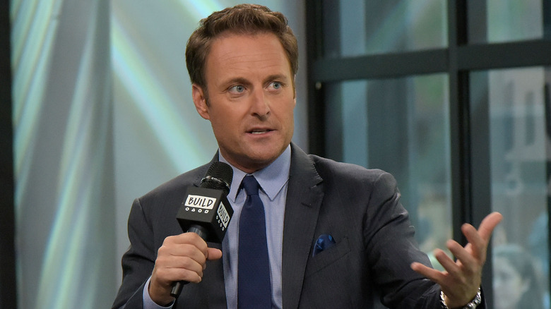 Chris Harrison speaking into a microphone in an interview