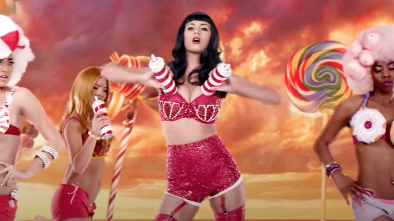 Katy Perry showing off her whipped-cream holster bra in the "California Girls" music video