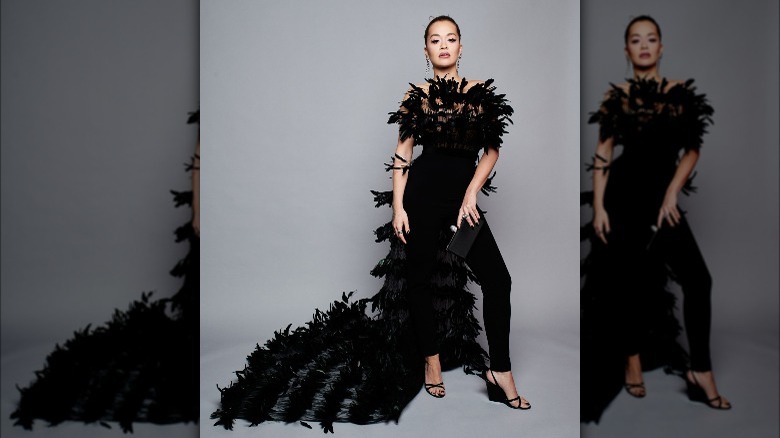 Rita Ora wearing a feathered jumpsuit