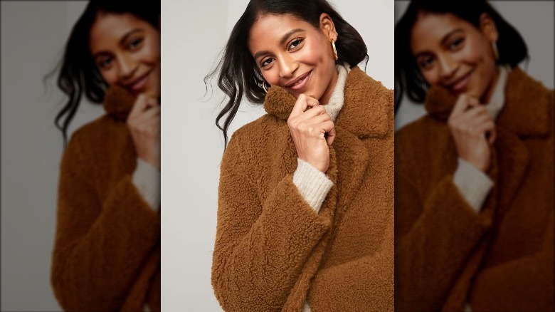 woman wearing old navy brown sherpa with mirror border