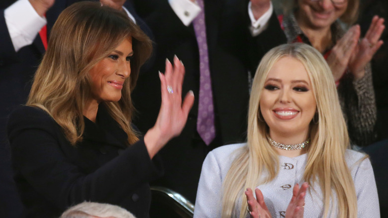 Melania Trump waves while Tiffany Trump claps