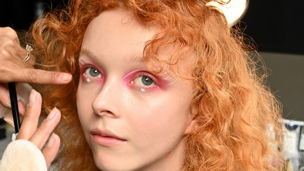 model for the Anna Sui showing off an old-school makeup trend