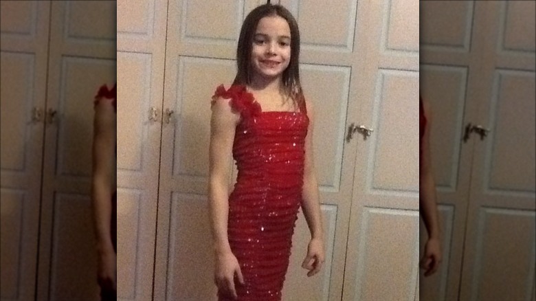 Young Olivia Dunne in a red sparkly dress