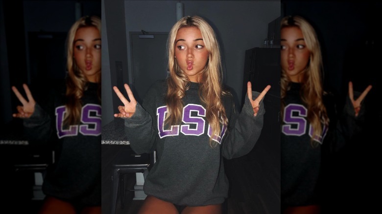 Olivia Dunne in a sweatshirt