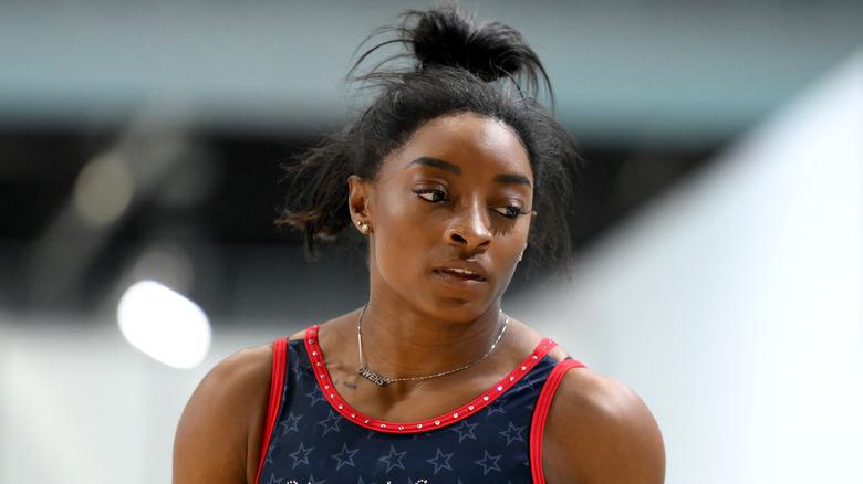 Simone Biles looking on