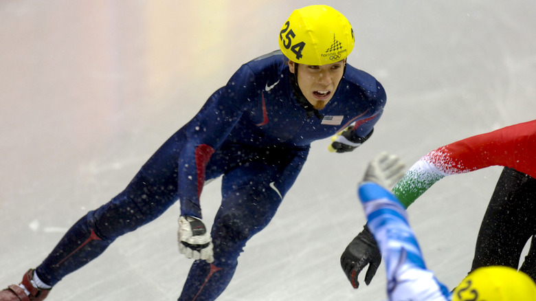 Apolo Anton Ohno speed skating at the Olympics