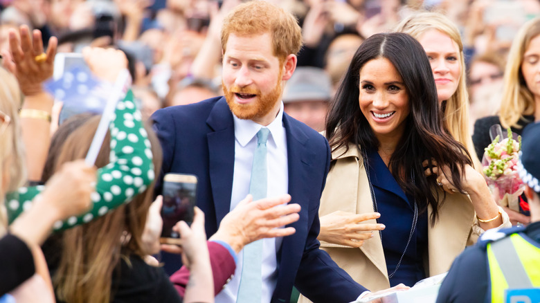 Prince Harry and Meghan Markle in crowd 