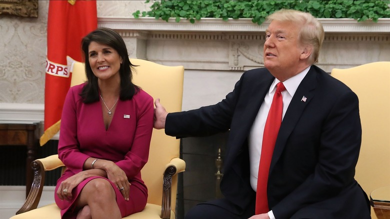 Trump hand on Nikki Haley's shoulder