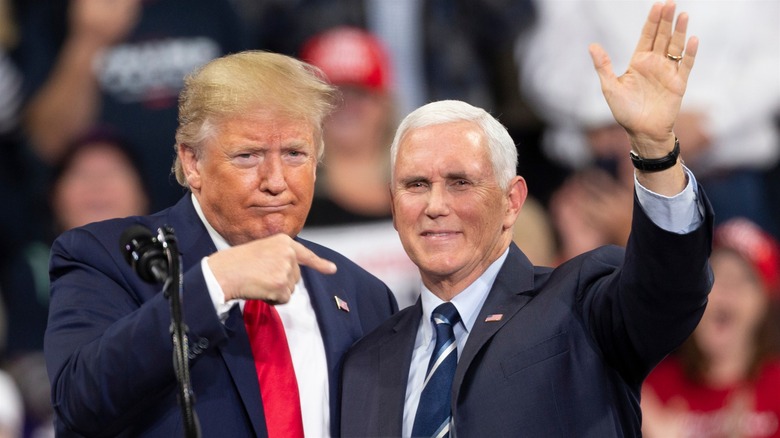 Trump pointing at a waving Mike Pence