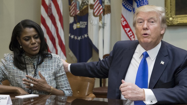 Donald Trump resting a hand on Omarosa Manigault Newman's shoulder