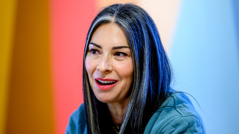 Stacy London wearing blue, speaking