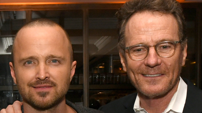 Aaron Paul and Bryan Cranston smiling together at an event