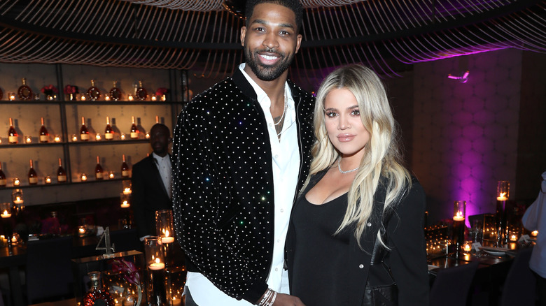 Tristan Thompson and Khloe Kardashian posing at birthday party 