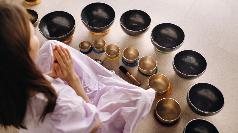 woman with Tibetan singing bowls