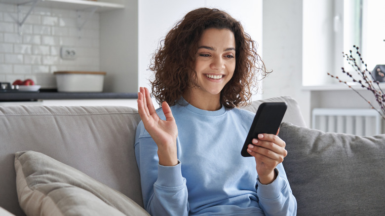 A woman video calling someone 