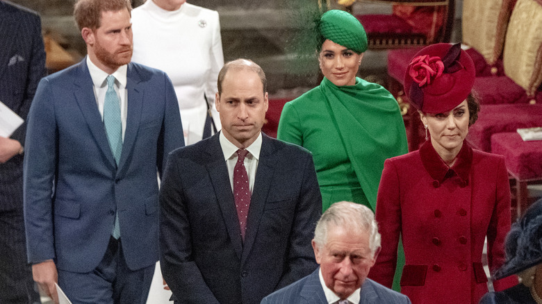 Royal family look grim church service