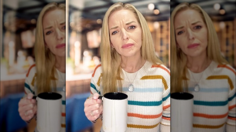 Ophelia Nichols holding coffee mug