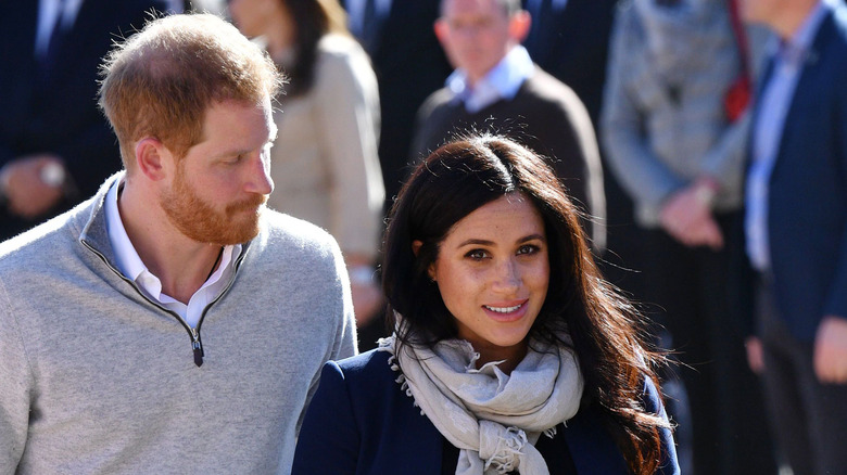 Prince Harry and Meghan Markle outdoors