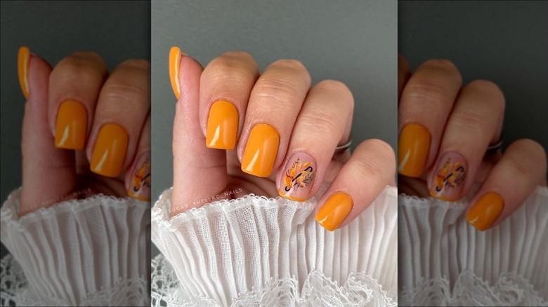 Orange nails and flower design