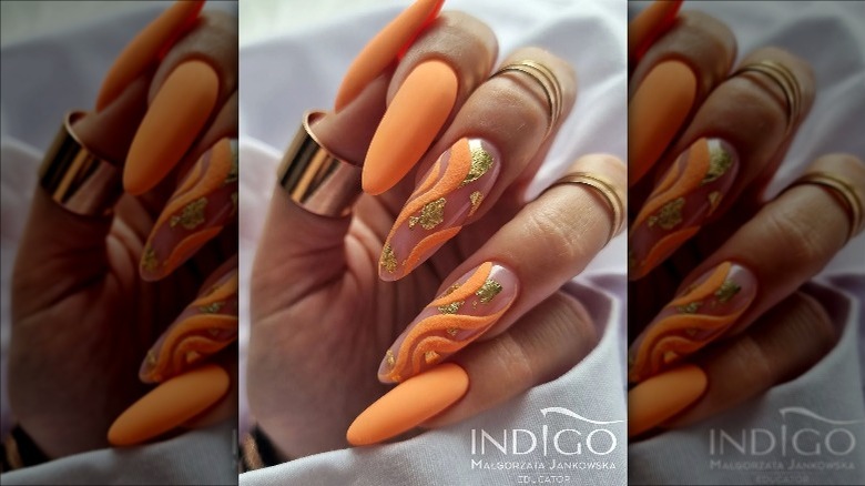 Orange and green swirl nails