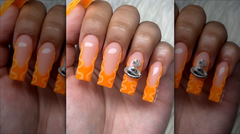 Orange nails with zigzag pattern