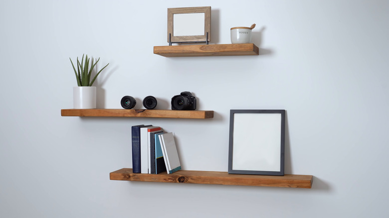 Floating shelves on white wall