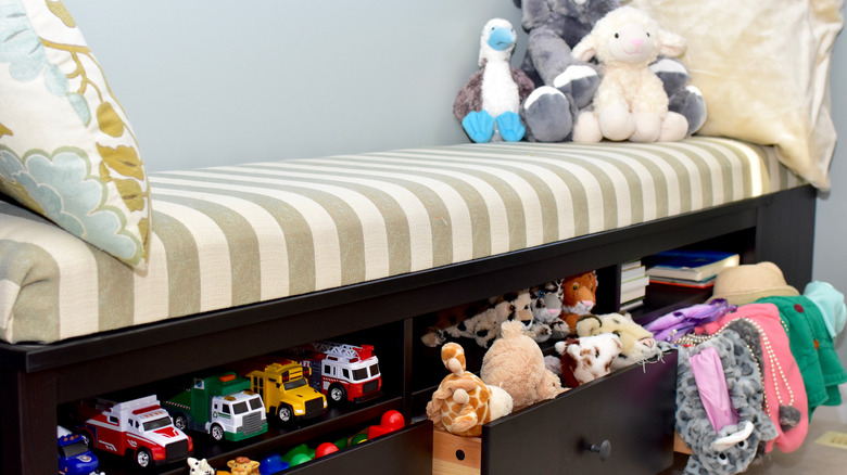 Storage bench holding toys