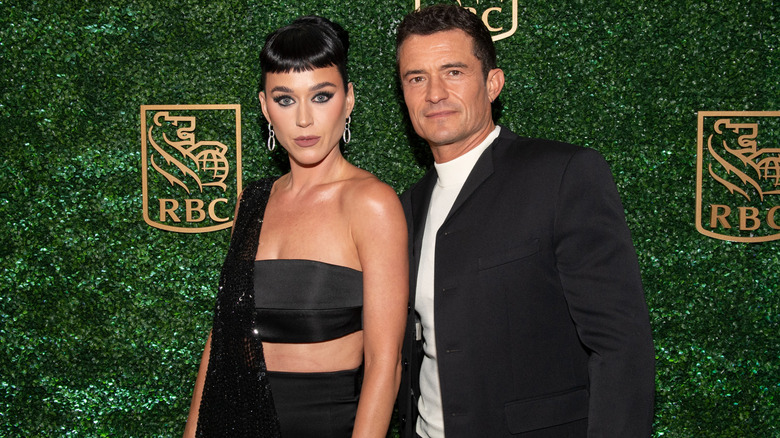 Katy Perry black dress Orlando Bloom black jacket