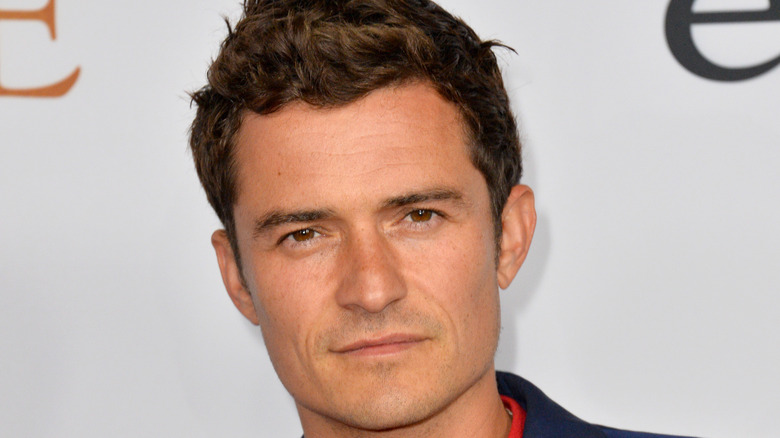 Orlando Bloom looks straight