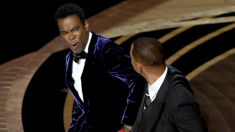 Chris Rock reacts to Will Smith slapping him