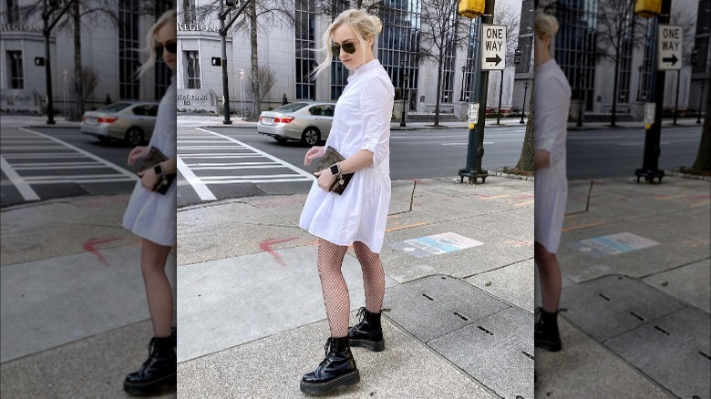 woman in white button down dress with fishnets