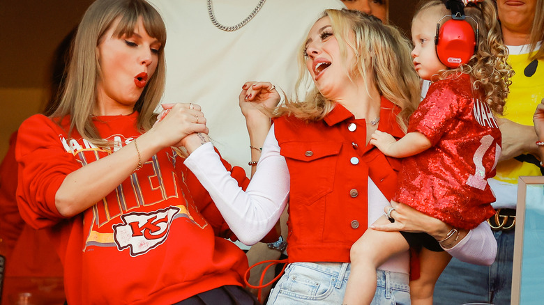 Taylor Swift and Brittany Mahomes laughing 