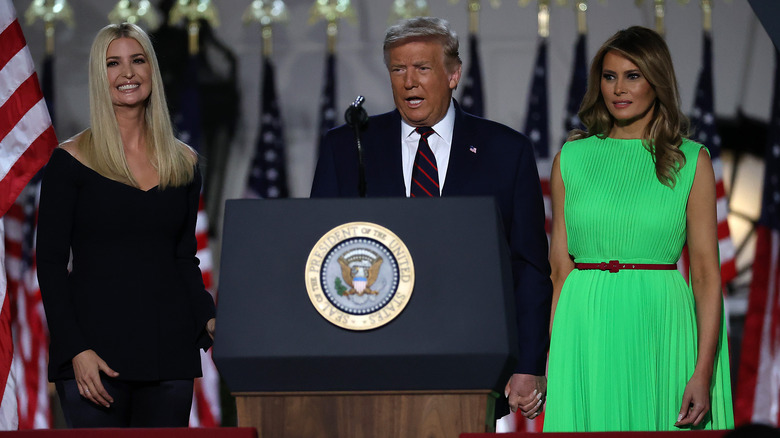 Melania, Donald, and Ivanka Trump at an event 