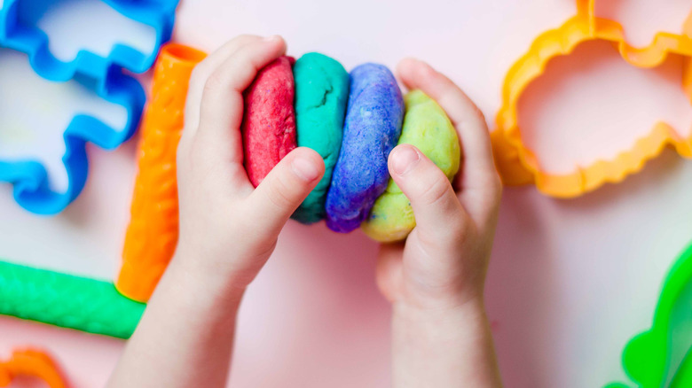 child playing with play-doh