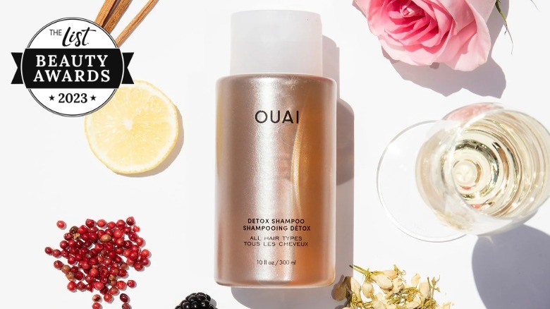 Bottle of OUAI detox shampoo covered in squirt of product