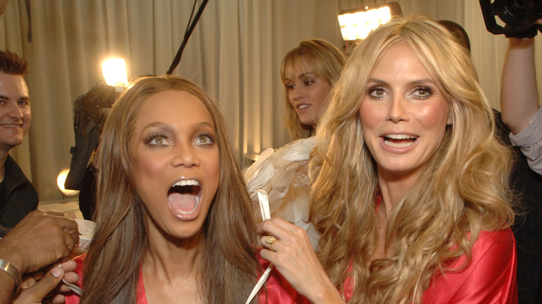 Tyra Banks laughing with Heidi Klum