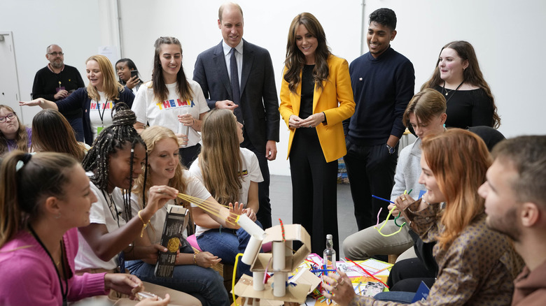 Prince William and Kate Middleton with young adults