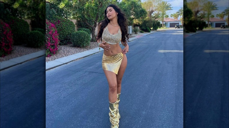 Woman wears gold outfit