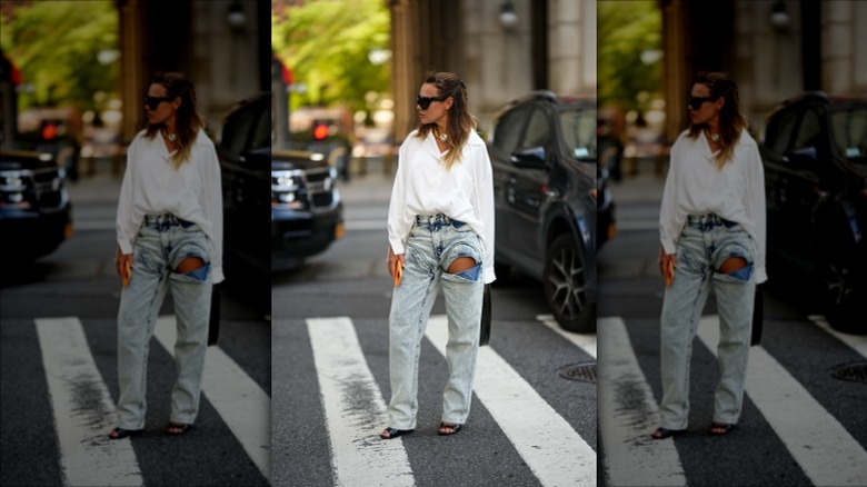 Woman in sunglasses looking away