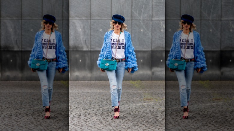 Woman wearing cap walking