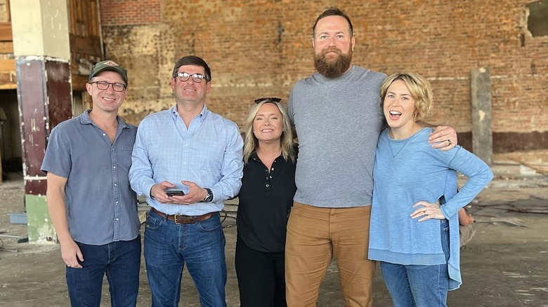 Ben and Erin Napier smiling with three other people