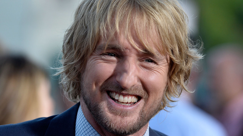 Owen Wilson smiles at an event