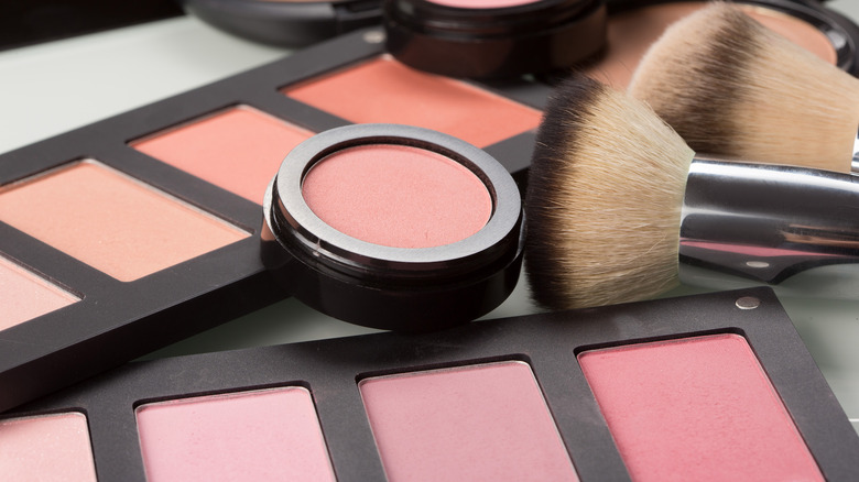 Powder blush with brush next to it