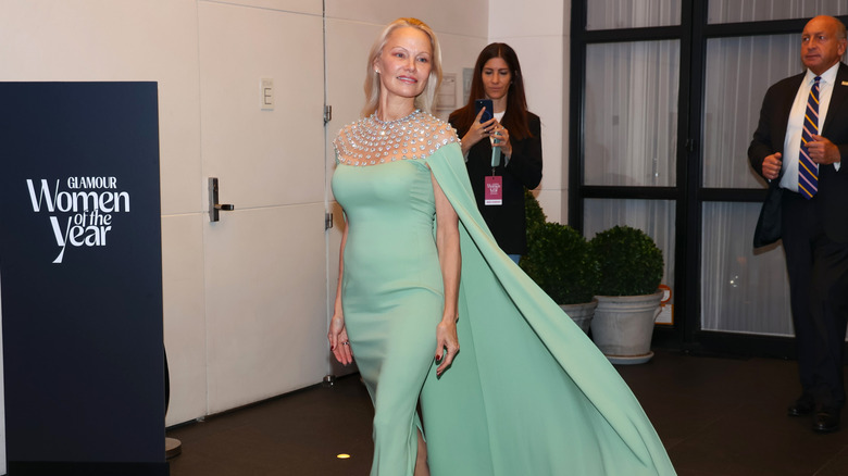 Pamela Anderson in a sage colored dress for Glamour Women of the Year awards in October 2024 in New York