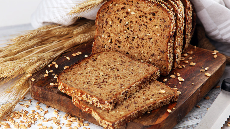 Whole grain bread with seeds against a rustic background