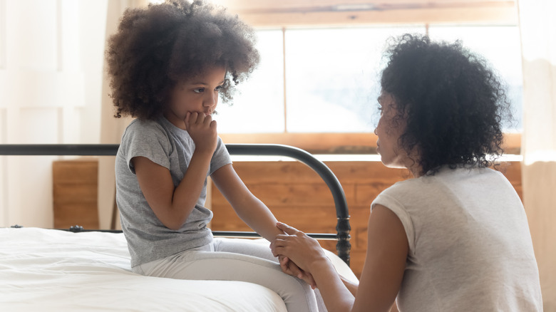 A mother and daughter having a serious discussion