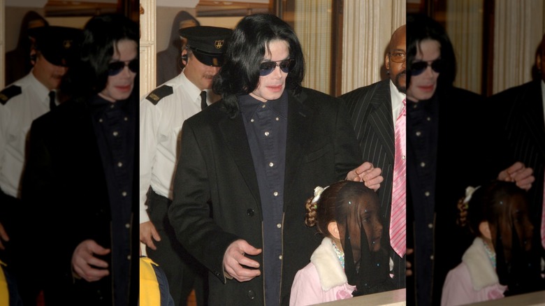 Michael Jackson with his veiled daughter, Paris Jackson