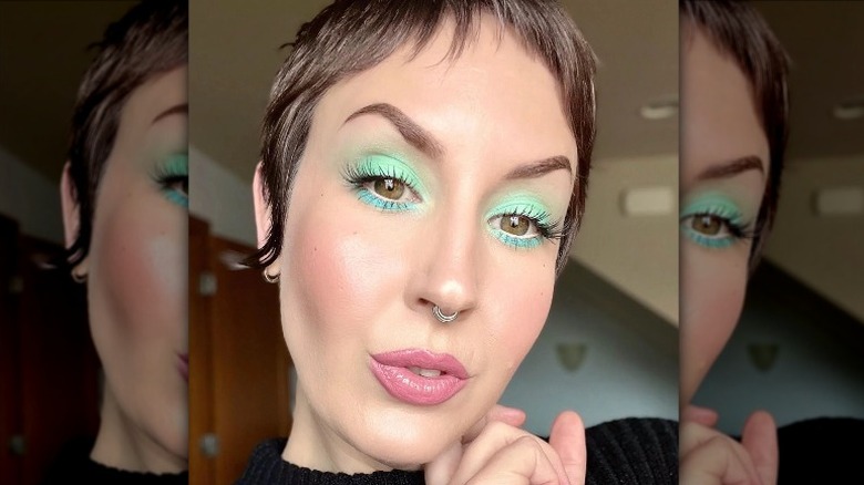 woman with pastel green eye makeup