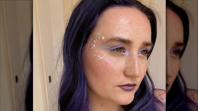 woman with pastel and starred makeup