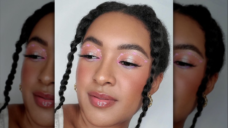 Woman with pink and white makeup